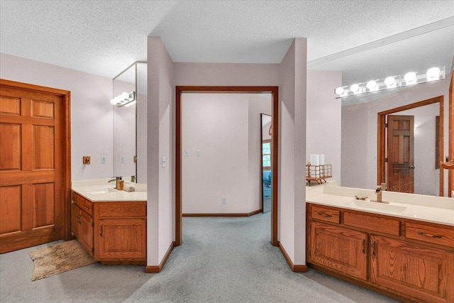 4008 Pinecrest Dr, Champaign, IL 61822 - full bath featuring two vanities, carpet, and a textured ceiling