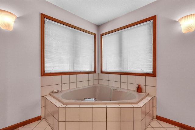 4008 Pinecrest Dr, Champaign, IL 61822 - bathroom with a bath and tile patterned flooring
