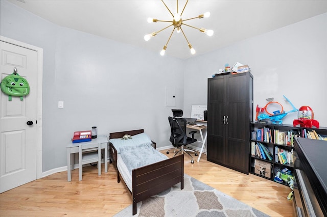 1637 W Columbia Ave Unit 3W, Chicago, IL 60626 - office space featuring light wood finished floors, a chandelier, electric panel, and baseboards