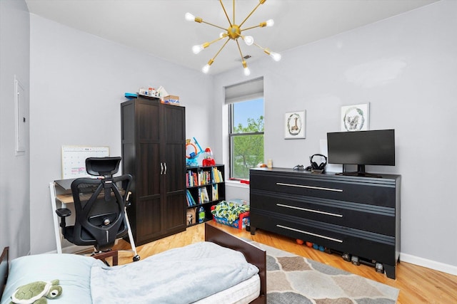 1637 W Columbia Ave Unit 3W, Chicago, IL 60626 - bedroom with a chandelier and light wood finished floors