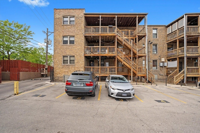1637 W Columbia Ave Unit 3W, Chicago, IL 60626 - view of building exterior with uncovered parking and stairway