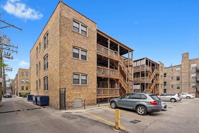 1637 W Columbia Ave Unit 3W, Chicago, IL 60626 - view of apartment building / complex featuring uncovered parking