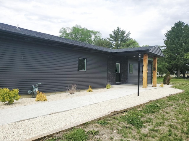 507 N Secor St, Gilman, IL 60938 - rear view of property with roof with shingles