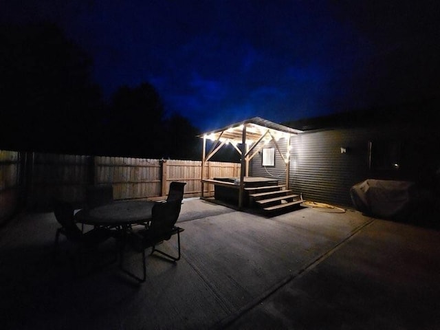 507 N Secor St, Gilman, IL 60938 - patio at twilight with a fenced backyard and a patio