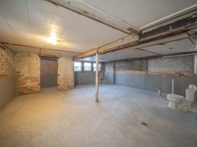 4912 S Komensky Ave, Chicago, IL 60632 - basement featuring brick wall