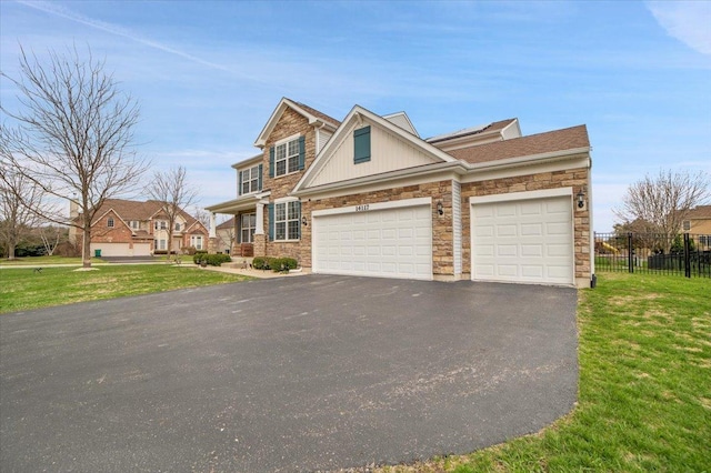 14117 Meadow Ln, Plainfield, IL 60544 - view of front facade featuring stone siding, asphalt driveway, and a garage