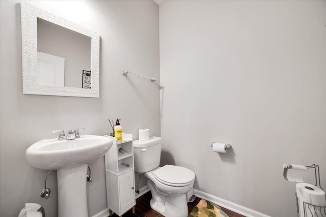 14117 Meadow Ln, Plainfield, IL 60544 - half bathroom with toilet, baseboards, and wood finished floors