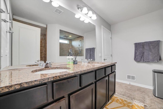 14117 Meadow Ln, Plainfield, IL 60544 - full bath featuring a tile shower, double vanity, and baseboards