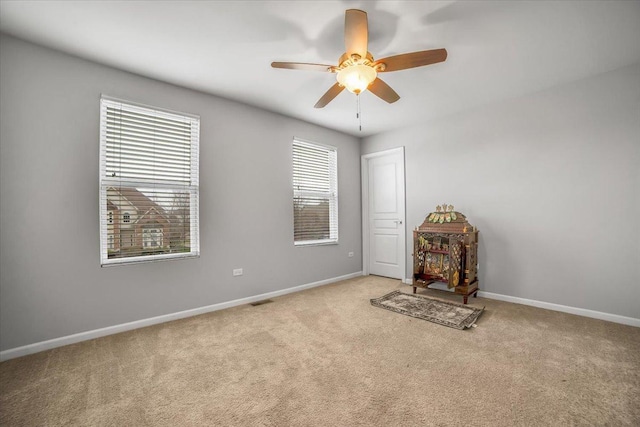 14117 Meadow Ln, Plainfield, IL 60544 - carpeted spare room with baseboards and a ceiling fan