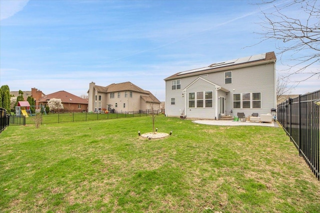 14117 Meadow Ln, Plainfield, IL 60544 - back of house featuring a patio area, roof mounted solar panels, and entry steps