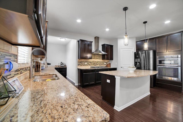14117 Meadow Ln, Plainfield, IL 60544 - kitchen with wall chimney exhaust hood, tasteful backsplash, appliances with stainless steel finishes, light stone counters, and dark brown cabinetry