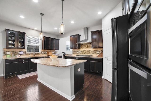 14117 Meadow Ln, Plainfield, IL 60544 - kitchen featuring wall chimney range hood, freestanding refrigerator, tasteful backsplash, dark wood finished floors, and recessed lighting
