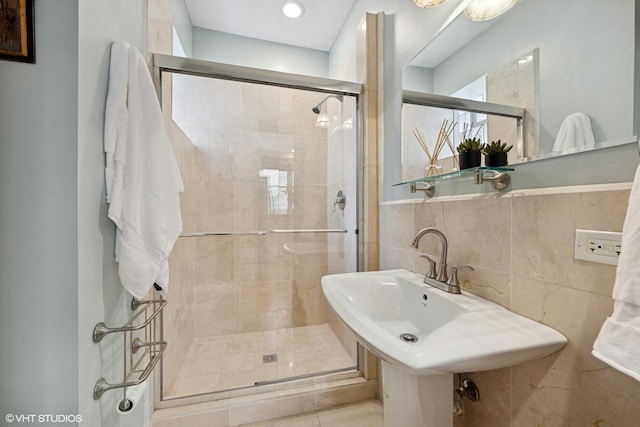 1621 W Rascher Ave Unit 2, Chicago, IL 60640 - bathroom with a stall shower, tile walls, and recessed lighting