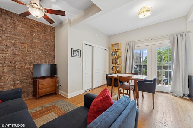 1621 W Rascher Ave Unit 2, Chicago, IL 60640 - living area with light wood-style flooring, ceiling fan, brick wall, and baseboards
