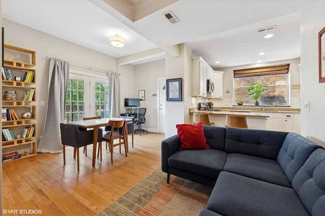 1621 W Rascher Ave Unit 2, Chicago, IL 60640 - living area featuring light wood-type flooring, healthy amount of natural light, and recessed lighting