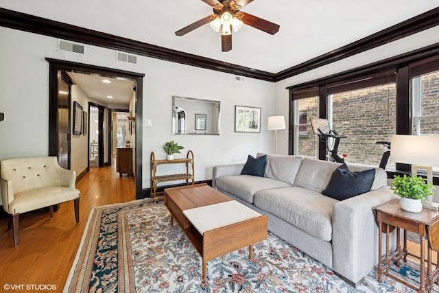 1621 W Rascher Ave Unit 2, Chicago, IL 60640 - living room featuring ceiling fan, wood finished floors, ornamental molding, and baseboards