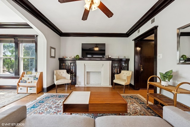 1621 W Rascher Ave Unit 2, Chicago, IL 60640 - living room with crown molding, ceiling fan, a brick fireplace, wood finished floors, and baseboards