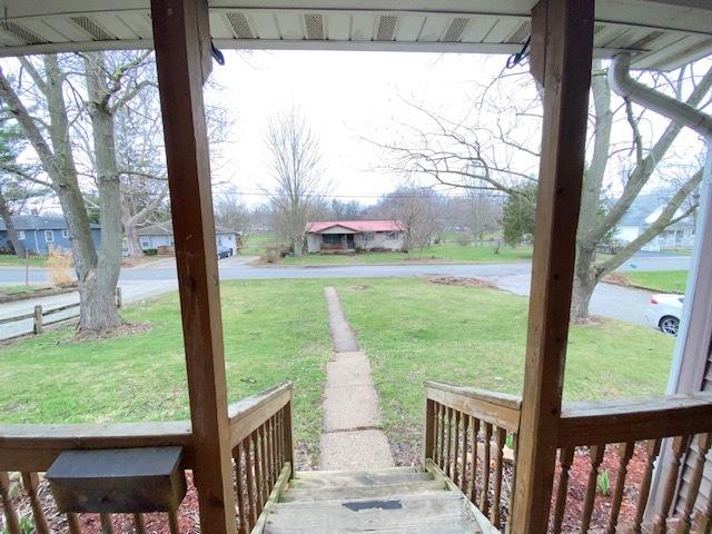 328 Castle St, Lowell, IN 46356 - view of green lawn featuring a porch
