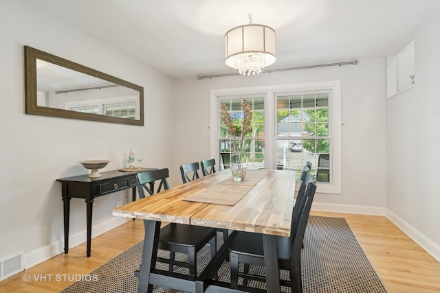 1101 S Nightingale Dr, Palatine, IL 60067 - dining room featuring light wood-type flooring and a chandelier