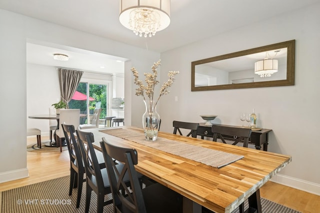 1101 S Nightingale Dr, Palatine, IL 60067 - dining space with light wood-type flooring and a chandelier