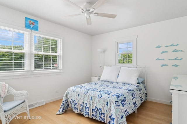 1101 S Nightingale Dr, Palatine, IL 60067 - bedroom featuring multiple windows, wood finished floors, and a ceiling fan