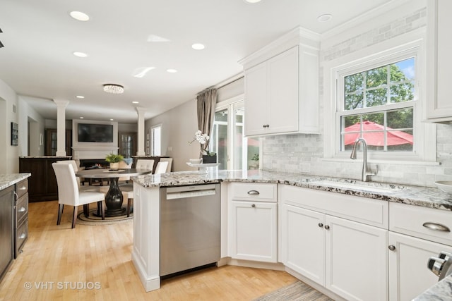 1101 S Nightingale Dr, Palatine, IL 60067 - kitchen with stainless steel dishwasher, decorative columns, healthy amount of natural light, white cabinetry, and recessed lighting