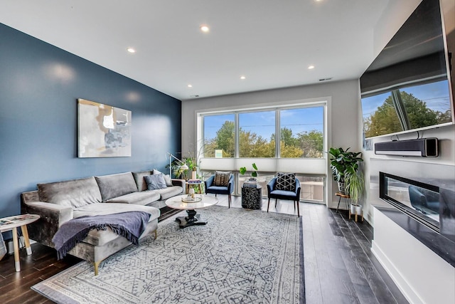 3224 N Elston Ave Unit 2S, Chicago, IL 60618 - living room featuring plenty of natural light, hardwood / wood-style floors, recessed lighting, a glass covered fireplace, and baseboards