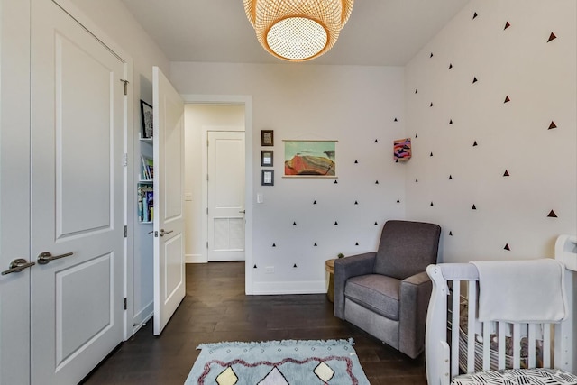 3224 N Elston Ave Unit 2S, Chicago, IL 60618 - bedroom featuring dark wood-type flooring, a chandelier, and baseboards