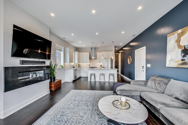 3224 N Elston Ave Unit 2S, Chicago, IL 60618 - living area featuring dark wood finished floors, recessed lighting, and baseboards