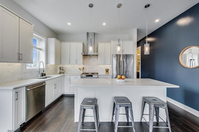 3224 N Elston Ave Unit 2S, Chicago, IL 60618 - kitchen with appliances with stainless steel finishes, wall chimney range hood, a sink, a kitchen bar, and a center island
