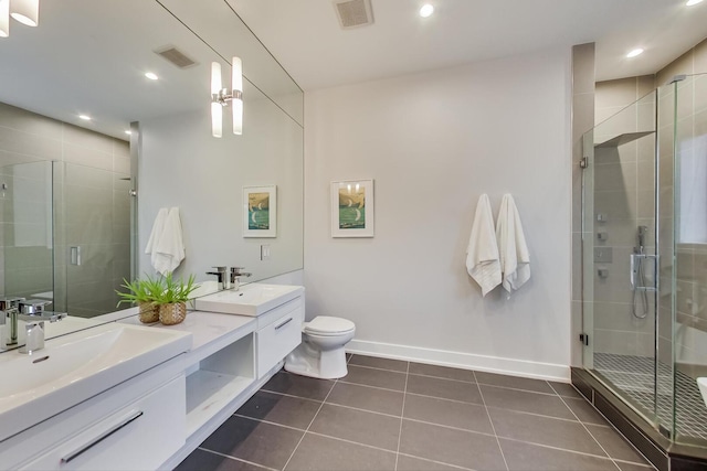 3224 N Elston Ave Unit 2S, Chicago, IL 60618 - full bathroom with double vanity, tile patterned flooring, baseboards, a stall shower, and toilet