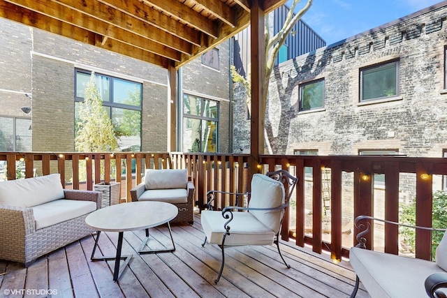 wooden terrace featuring outdoor lounge area