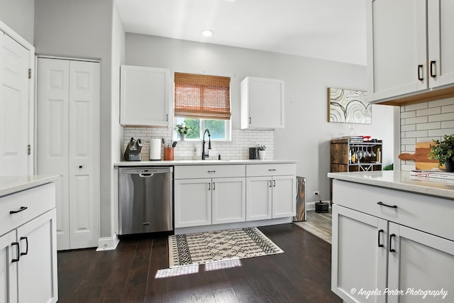 28912 Sawmill Ln, Lakemoor, IL 60051 - kitchen featuring stainless steel dishwasher, backsplash, white cabinetry, dark wood finished floors, and recessed lighting