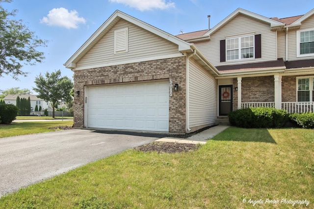 28912 Sawmill Ln, Lakemoor, IL 60051 - view of front of home with brick siding, driveway, and a front lawn