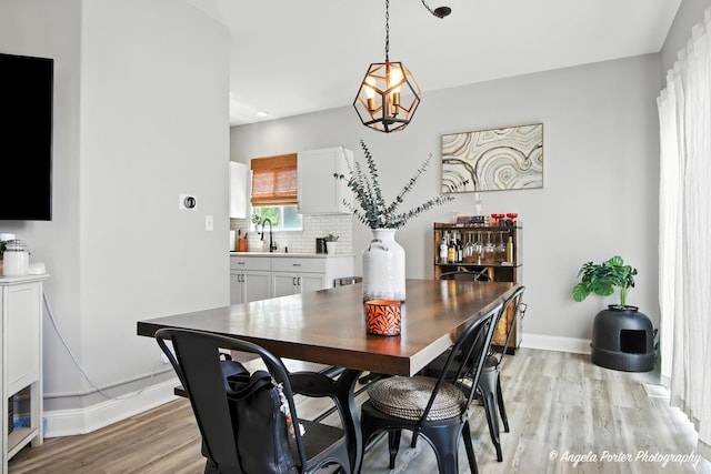 28912 Sawmill Ln, Lakemoor, IL 60051 - dining room featuring light wood-style flooring, a chandelier, and recessed lighting