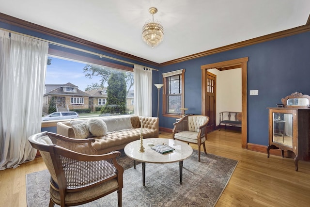 5912 W Grace St, Chicago, IL 60634 - living area with baseboards, a chandelier, wood finished floors, and ornamental molding