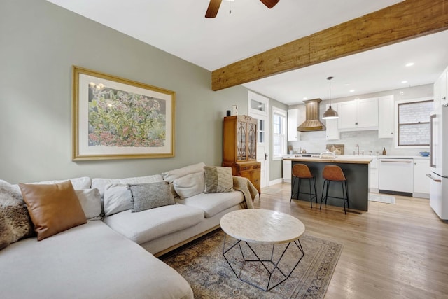 5912 W Grace St, Chicago, IL 60634 - living room with light wood-type flooring, a ceiling fan, beam ceiling, recessed lighting, and baseboards