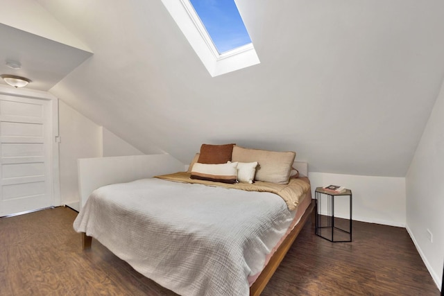 5912 W Grace St, Chicago, IL 60634 - bedroom featuring vaulted ceiling, wood finished floors, a skylight, and baseboards