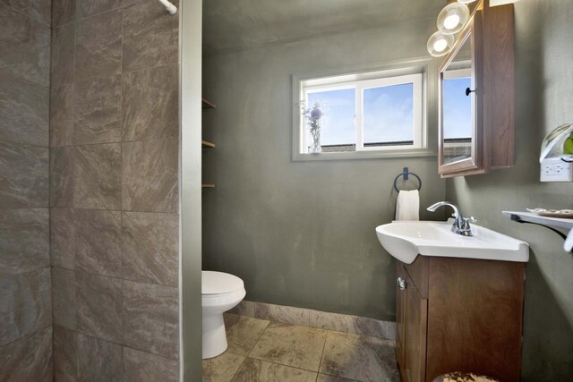 5912 W Grace St, Chicago, IL 60634 - bathroom with vanity, tiled shower, and toilet