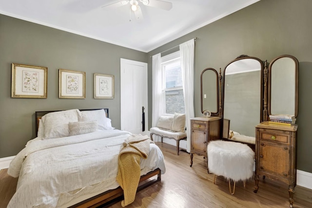 5912 W Grace St, Chicago, IL 60634 - bedroom with wood finished floors, crown molding, a ceiling fan, and baseboards
