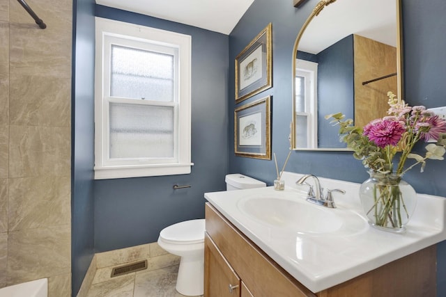 5912 W Grace St, Chicago, IL 60634 - full bathroom with toilet, vanity, a shower, and baseboards