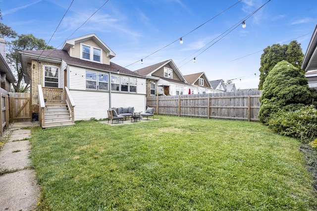 5912 W Grace St, Chicago, IL 60634 - back of property featuring an outdoor hangout area and a shingled roof