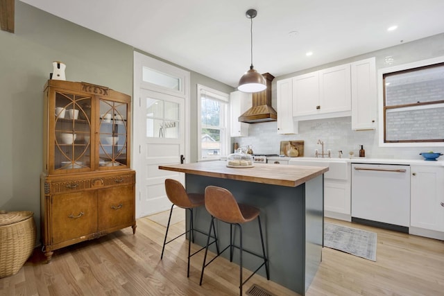 5912 W Grace St, Chicago, IL 60634 - kitchen featuring dishwasher, wooden counters, light wood-style flooring, white cabinetry, and recessed lighting