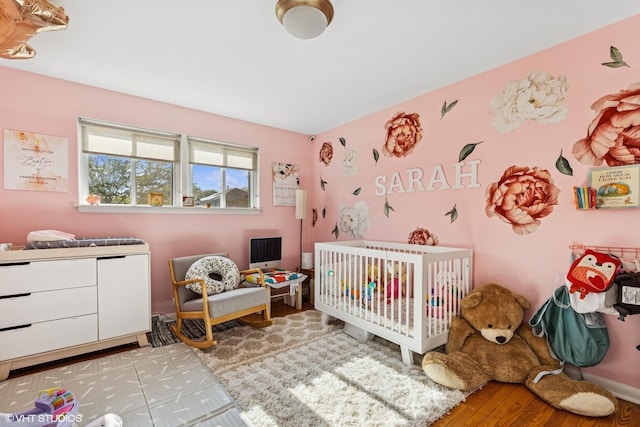 9351 Kostner Ave, Skokie, IL 60076 - bedroom with a crib and wood finished floors