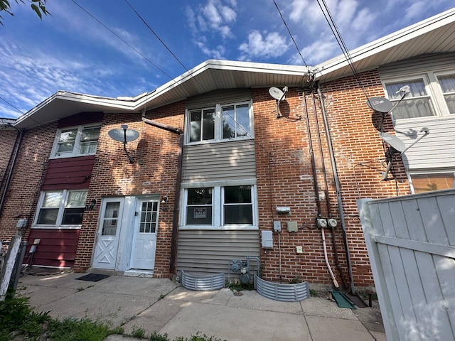 1370 Fargo Ave Unit E, Des Plaines, IL 60018 - view of front facade with fence and brick siding