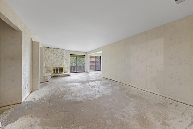 1S055 Spring Rd Unit 2B, Oakbrook Terrace, IL 60181 - unfurnished living room with a stone fireplace