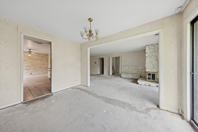 1S055 Spring Rd Unit 2B, Oakbrook Terrace, IL 60181 - unfurnished living room featuring a chandelier, a fireplace, and ceiling fan