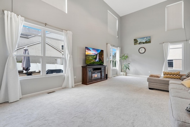 755 Rockhurst Rd, Bolingbrook, IL 60440 - carpeted living room with a towering ceiling and a glass covered fireplace