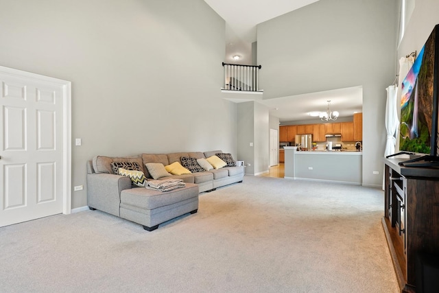 755 Rockhurst Rd, Bolingbrook, IL 60440 - living room featuring a towering ceiling, a chandelier, and light carpet