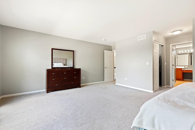755 Rockhurst Rd, Bolingbrook, IL 60440 - bedroom featuring light carpet, ensuite bath, and a closet